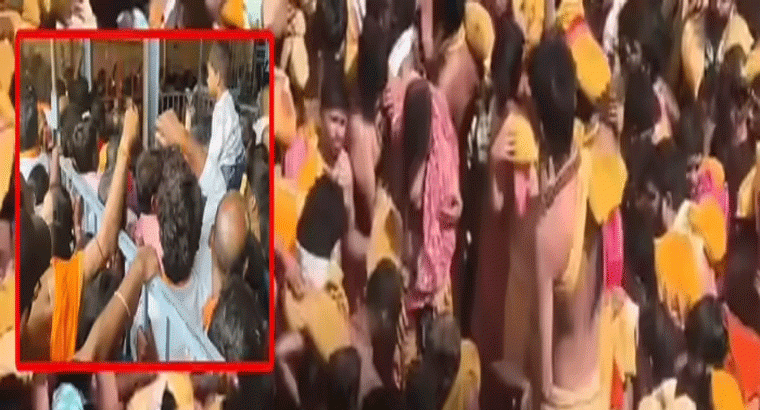 క్యూలైన్లు విరగ్గొట్టి.. శివస్వాముల ఆందోళన