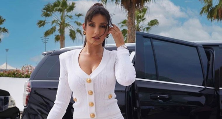 వైట్ డ్రెస్ లోస్టైలిష్ గా  నోరా ఫతేహి